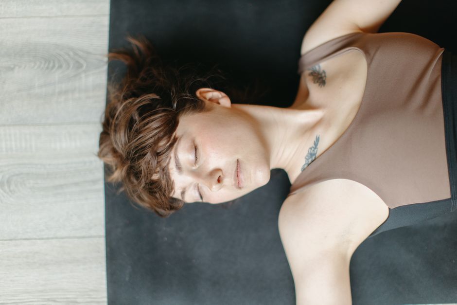 A student resting deeply during a restorative class